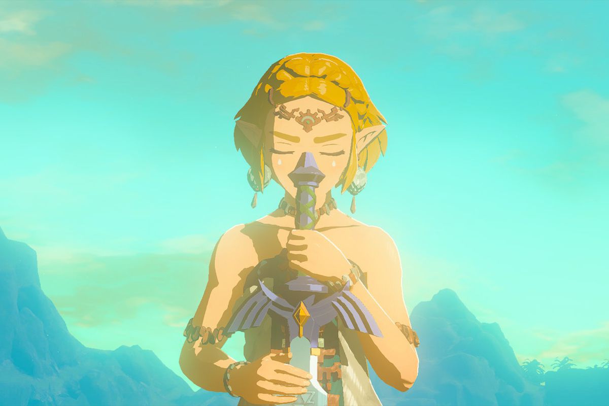 Princesa Zelda segura a Master Sword de cabeça para baixo com os olhos fechados em The Legend of Zelda: Tears of the Kingdom